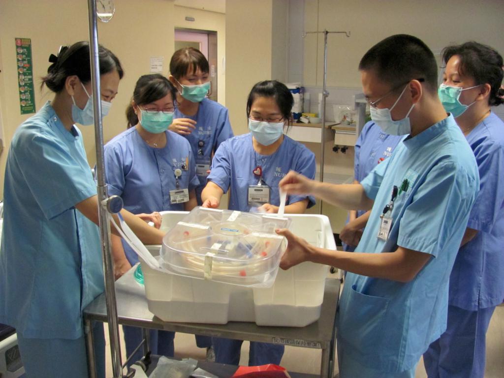 Nurses and Doctors learning happily to prime the ECMO circuit together, ICU, PYNEH